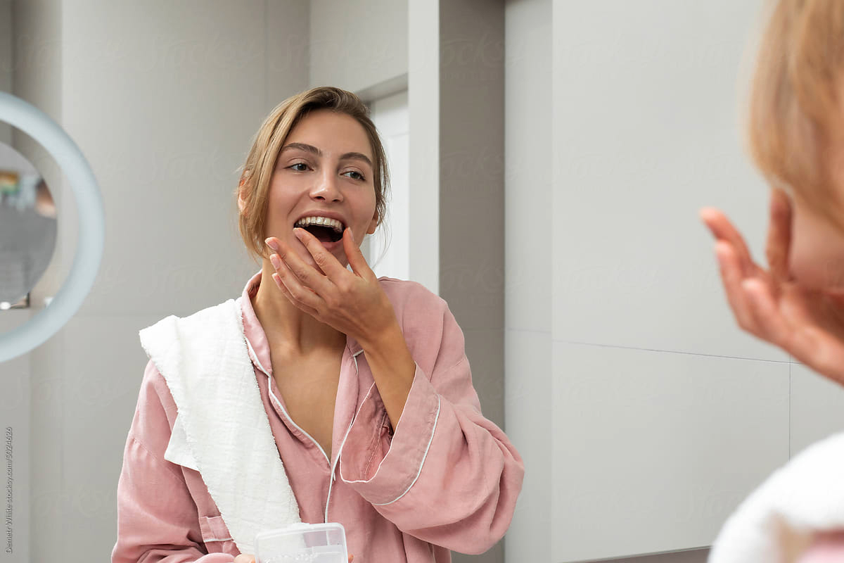 woman looking at teeth