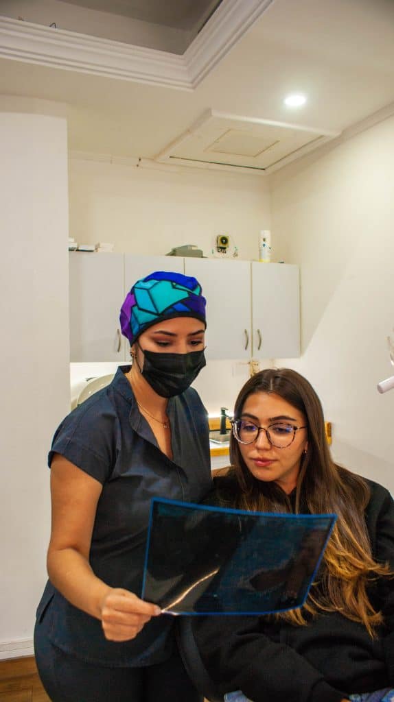 Dentist in Deerfield Beach Florida showing a patient how to prevent tooth loss