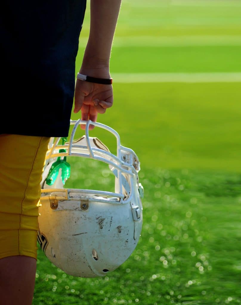 Football helmet with a mouthguard