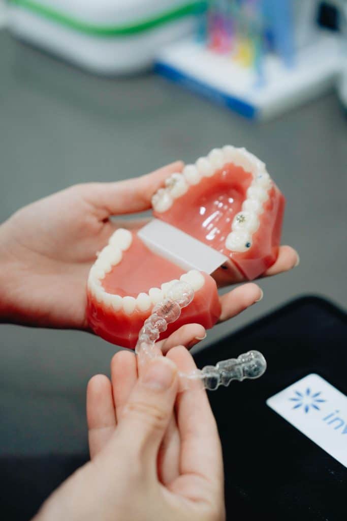 Dentist measuring a retainer