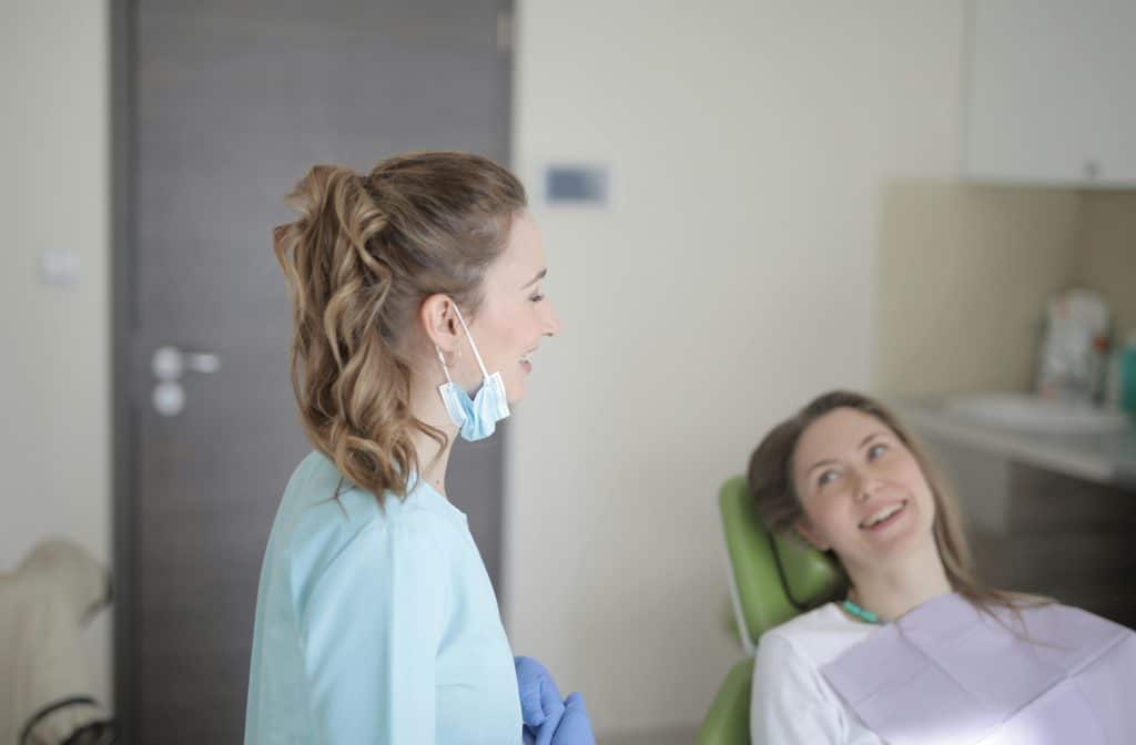 Dentist talking with patient