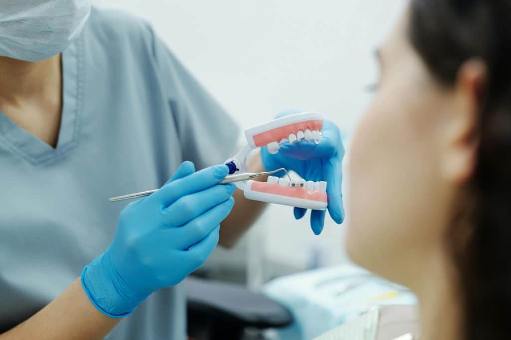 Orthodontist showing braces