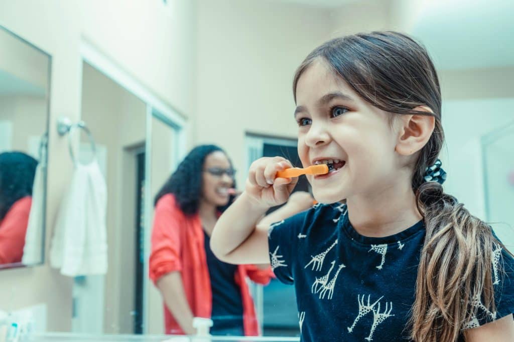 Child brushing teeth