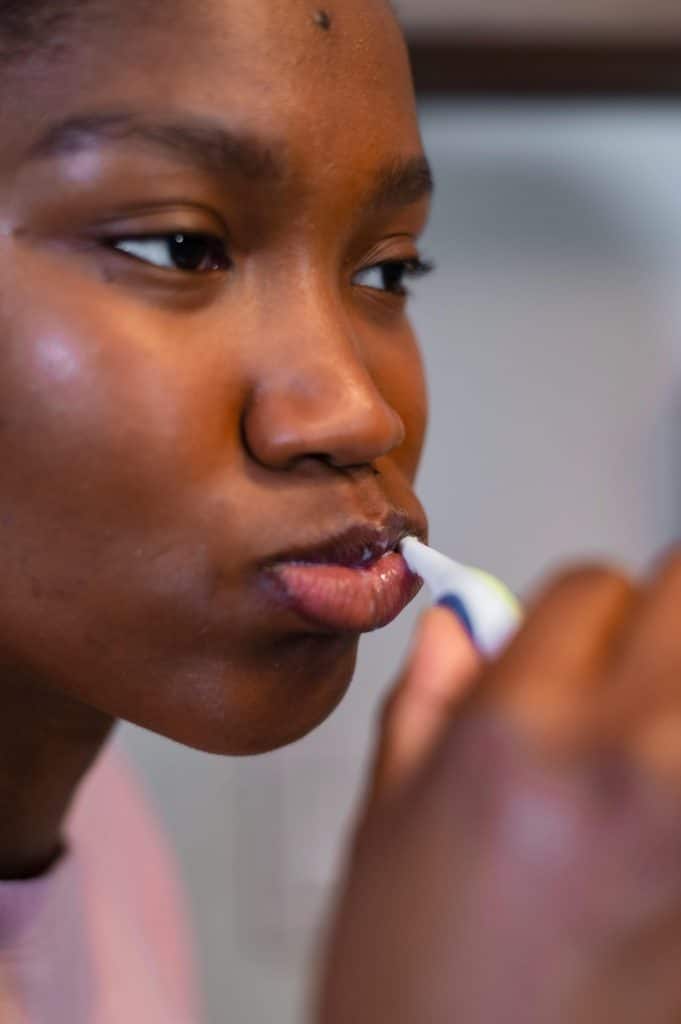 woman brushing her teeth