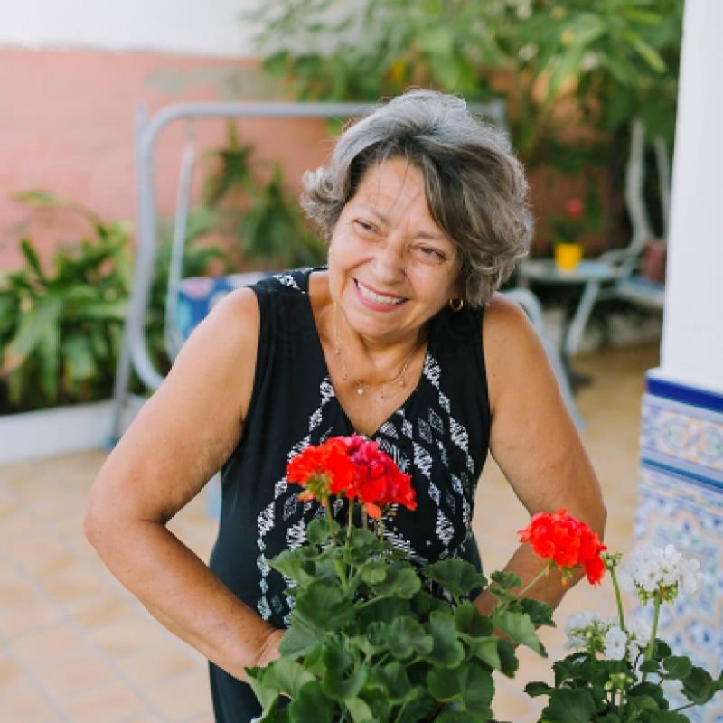 Old woman with red flower